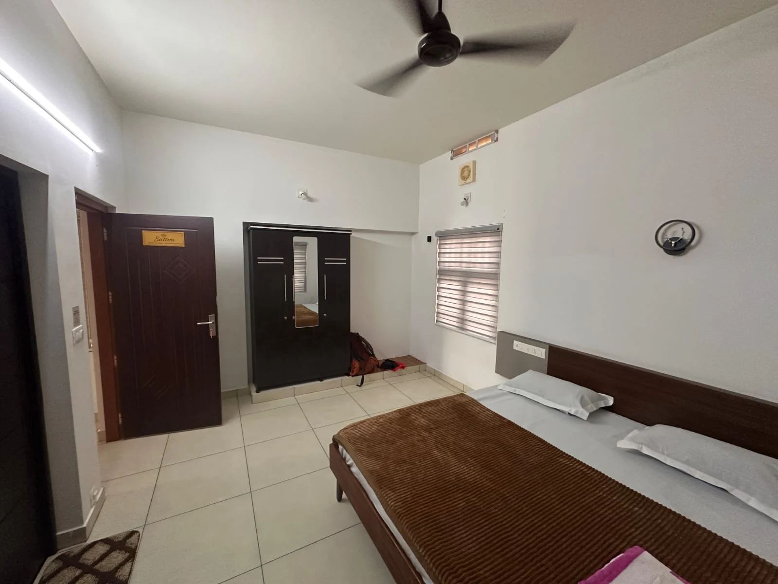 Sattva bedroom with double bed and air conditioning
